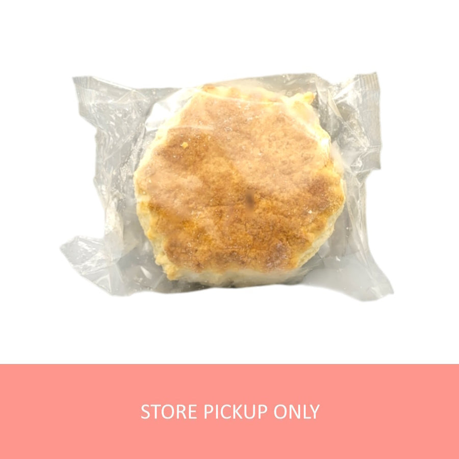 An individually packaged frozen scone in a clear plastic bag.